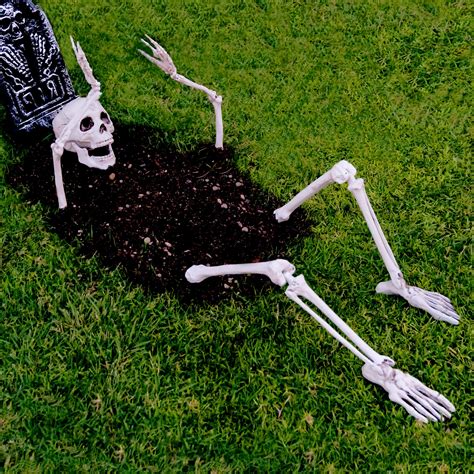 funny skeleton yard decorations|skeleton climbing out of ground.